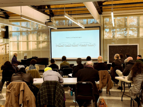 MFA in Music Composition Faculty Rick Baitz teaching to a room full of Music Composition students