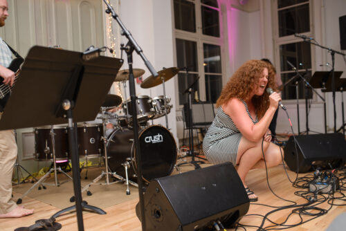 VCFA student sings with passion during a performance.