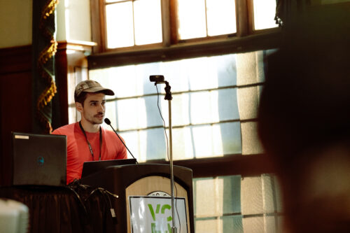 VCFA faculty member speaks to a crowd during a WCYA residency.