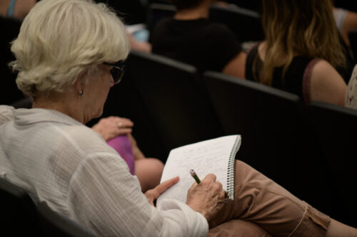 VCFA writing student takes notes on how to write dialogue.