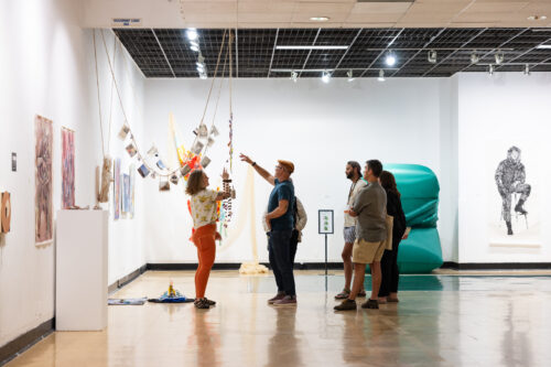 Image of VCFA Visual Art students engaging in critiques 