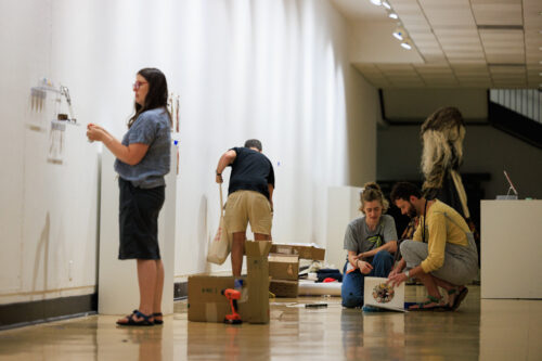 VCFA visual art students prepare a gallery showing of art.