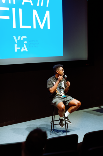 Close-up of MFA in Film faculty member Damon Davis presenting at a VCFA summer residency