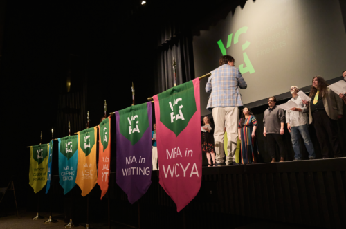 VCFA's six MFA program banners at the summer 2024 residency 